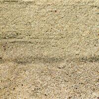 Top view of Brown sand.Sandy beach for background with copy space and visible sand texture. photo