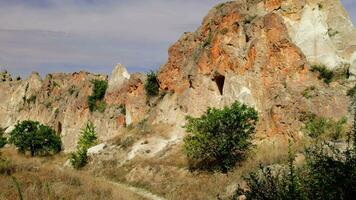 Goreme National Park. There are rock formations and house structures. video