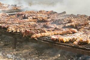 traditional meat grilled on the grill in the Argentine countryside photo