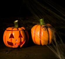 decoration for the celebration of hallowen with pumpkins, spiders, candles photo