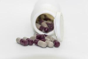 Detail of a bottle of capsules with medical drugs.Concept Medicine, health photo