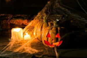 decoration for the celebration of hallowen with pumpkins, spiders, candles photo