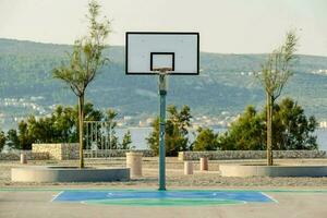 an empty basketball court with a green paint photo