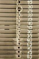 a chain is attached to a metal rack photo