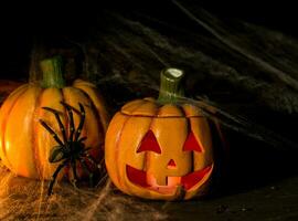 decoration for the celebration of hallowen with pumpkins, spiders, candles photo