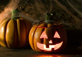 decoration for the celebration of hallowen with pumpkins, spiders, candles photo