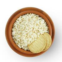 Top view of Indiana Puffed Rice and two biscuits on a brown clay pot, isolated on a white background. photo