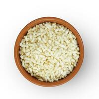 Top view of Indiana Puffed Rice in a brown clay pot, isolated on a white background. photo