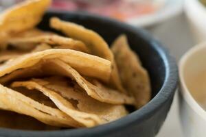 Mexican tortilla chips in molcajete photo