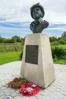 Statue and memorial for Major John Howard, close to the Pegasus Bridge. Normandy France. August 15 2023. photo