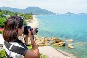 Woman photography at Lamai beach photo