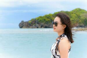 Woman tourist on the beach in Thailand photo