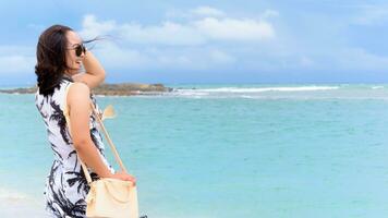 Woman tourist on the beach in Thailand photo