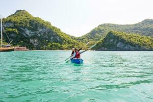 Travel by boat with a kayak photo