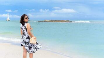 Woman tourist on the beach in Thailand photo