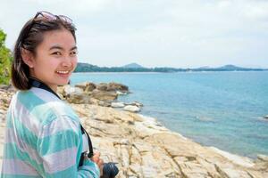 Young woman photography near the sea photo