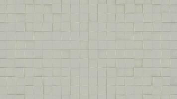 grigio rigonfio piazze geometrico piastrella sfondo. sporgente grigio Opaco digitale mosaico modello. creativo 3d grafico design movimento animazione parete. video