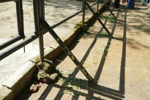 iron fence background in countryside with sun shadow photo