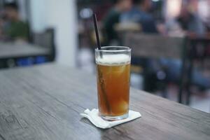 Lychee tea or lychee tea. Iced Tea or Fresh Drink in a glass with a cafe background photo