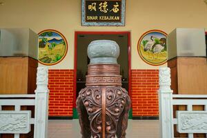 Solo, Indonesia - June 13, 2022 worship buildings, pagodas with bright colors and Chinese carvings. photo