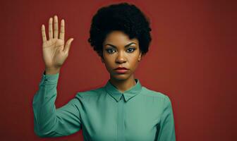 Woman black confidently displaying a stop hand sign. AI generative. photo