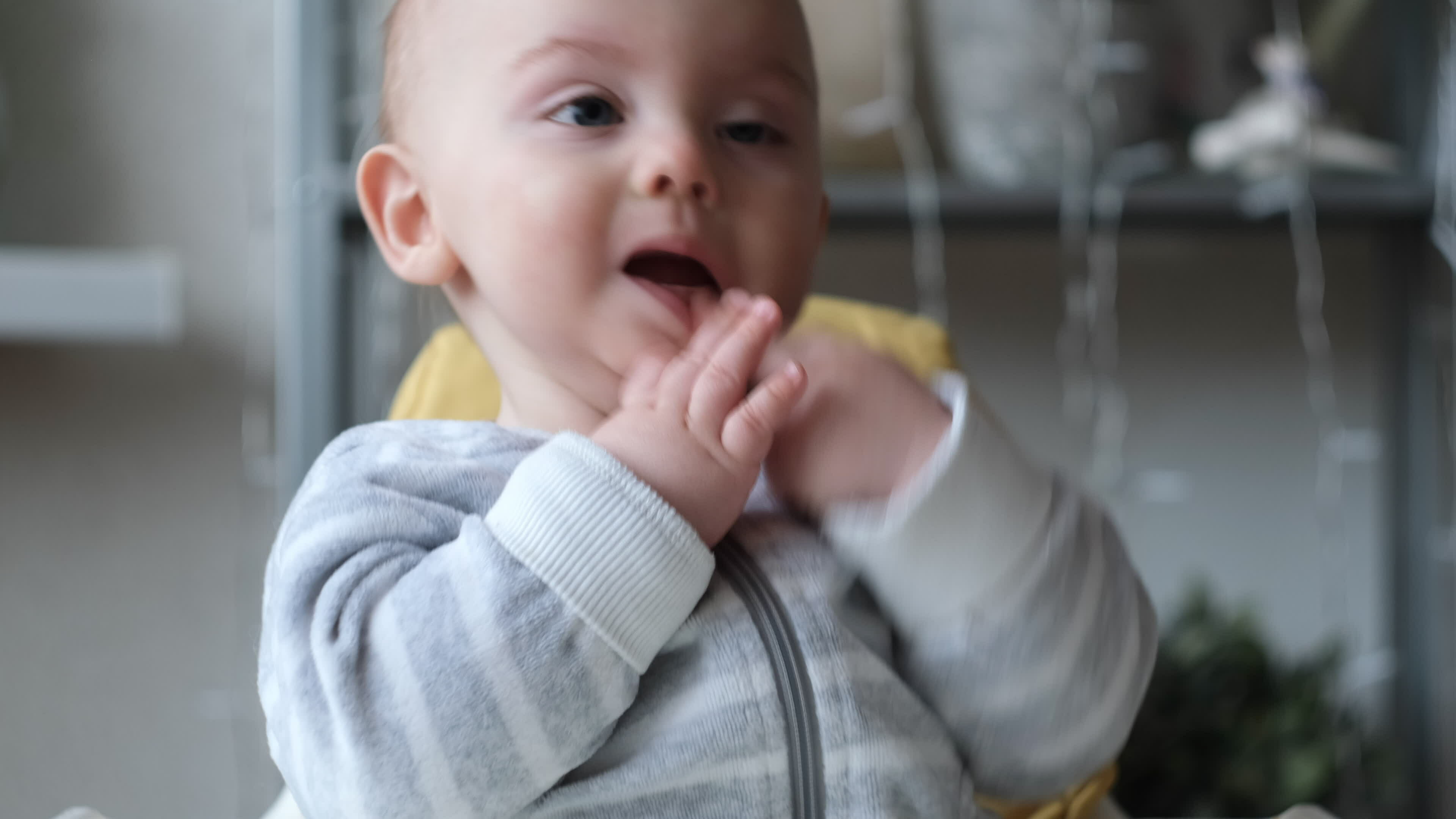 Upset infant boy portrait. Baby touches his face, want to sleep. 33007732 Stock Video at Vecteezy