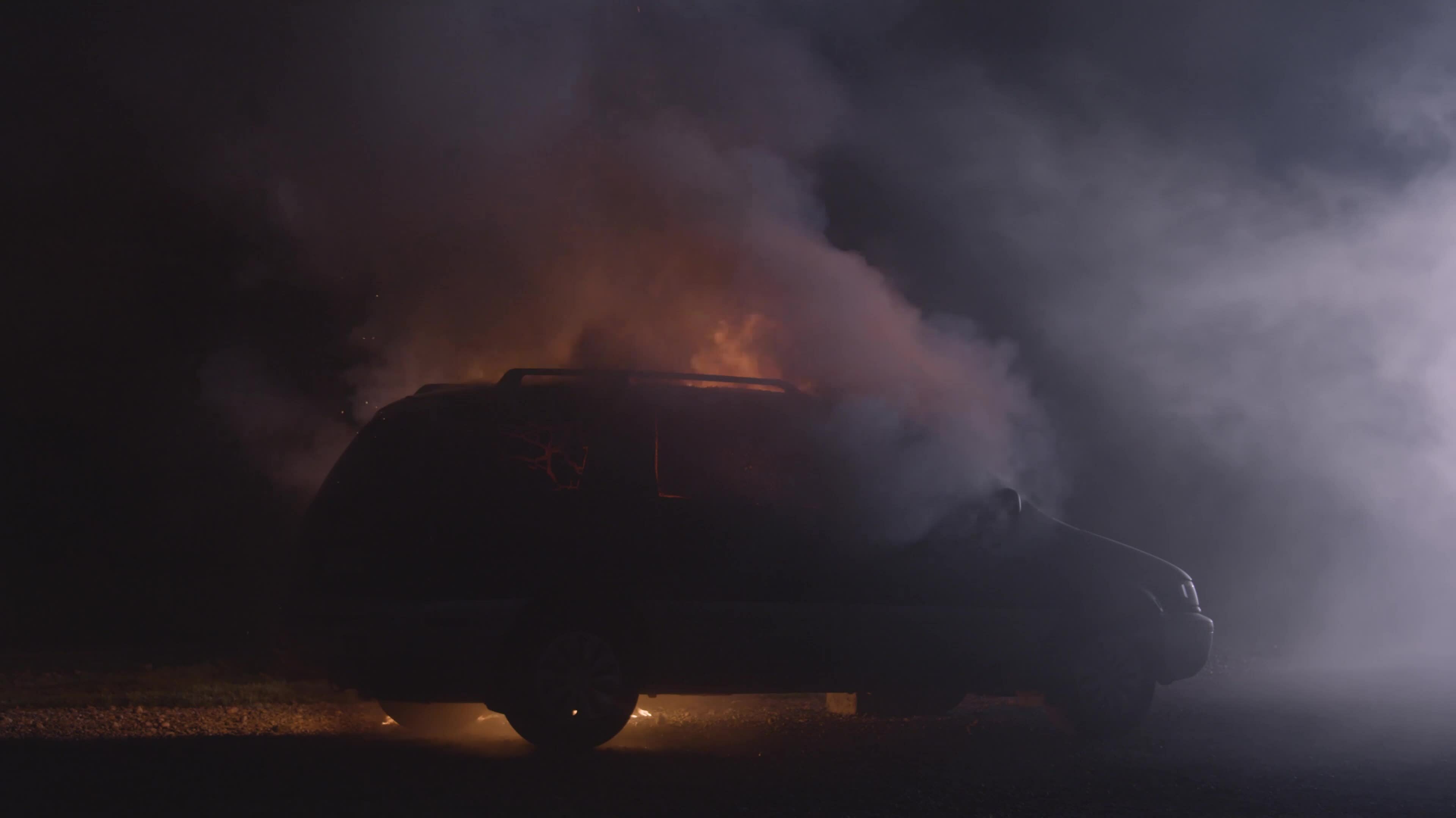 Starting car fire. Automobile fire start at night. Car explosion black background. Burning iron