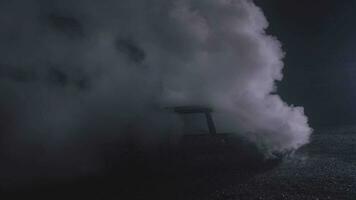 White smoke from a fire on a car on a black background in slow motion recorded with the RED camera. video