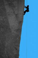 Climber  on  overhanging  cliff of Monkey Face photo