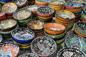 Brightly colored porcelain dishes from pottery factory photo