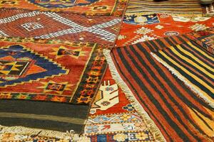 Overlapping carpets with intricate Kurdish  patterns photo