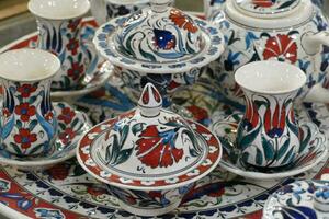 Pottery displayed in cave factory showroom photo