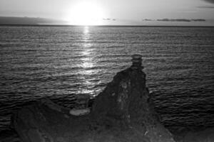 picturesque ocean landscape with the setting sun in a tropical country during summer holidays photo