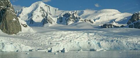 Glaciated mountains and icefall photo