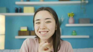 Close-up portrait of funny and beautiful Asian young woman. video