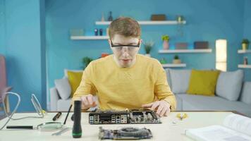Young man dealing with electronics. video