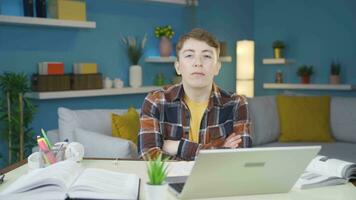 Student looking at camera with dull expression. video