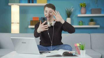 Student making a video call on the phone.