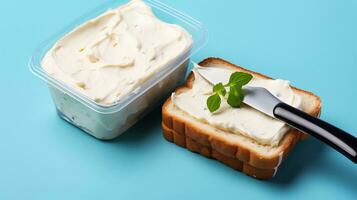 A photo of Butter in a plastic container on a blue background with bread. Generative AI