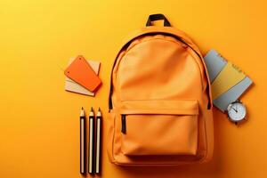 School backpack with stationery on orange background, top view. Back to school day concept Generative AI photo