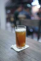 Lychee tea or lychee tea. Iced Tea or Fresh Drink in a glass with a cafe background photo