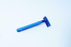 blue razor on plain background photo