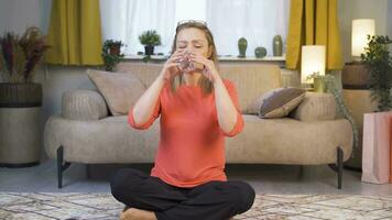 The woman is drinking water. video