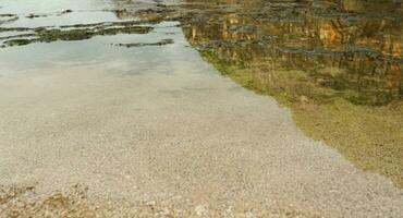 the atmosphere of low tide and beach sand in the morning photo