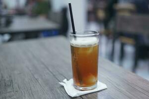 Lychee tea or lychee tea. Iced Tea or Fresh Drink in a glass with a cafe background photo