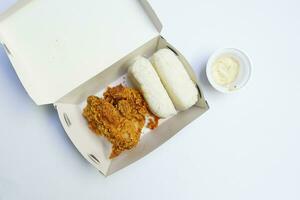 Fried chicken with boxed rice and carbonara sauce in a box photo
