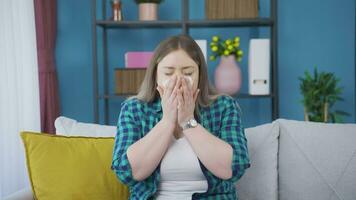 Woman covering mouth and nose while sneezing. video