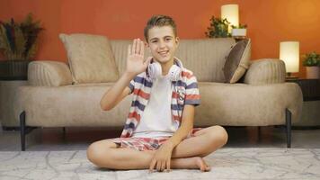 Boy waving at the camera. video