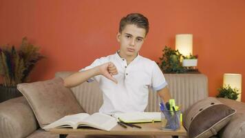 Unhappy and sad boy looks at camera with negative gesture expression. video