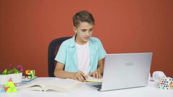 Boy making video call on laptop.